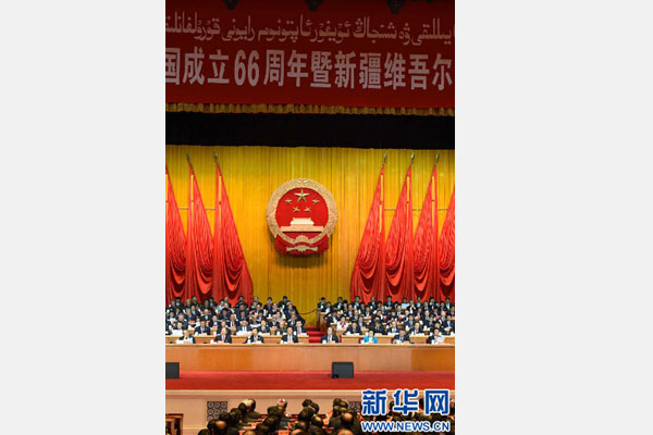 10月1日，慶祝中華人民共和國成立66周年暨新疆維吾爾自治區成立60周年大會在新疆人民會堂隆重舉行。 新華社記者 高潔 攝 
